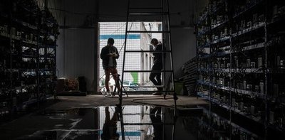 An expansive mining farm with rows of mining machines operating efficiently